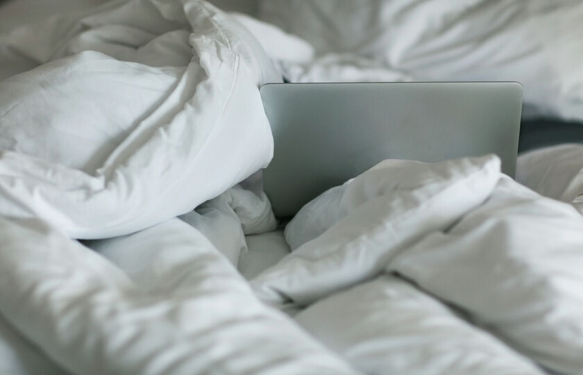 Bed and laptop